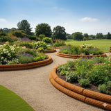 HEIGER coconut fibre garden edging defines beautiful flower beds in a lush garden landscape