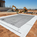 Construction site with composite biaxial geogrid with geotextile laid out for ground stabilization