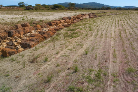 HEIGER jute mesh used on soil for erosion control against rocky slope in outdoor landscape