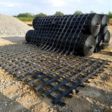 HEIGER PET biaxial geogrid rolls stacked for construction and civil engineering projects