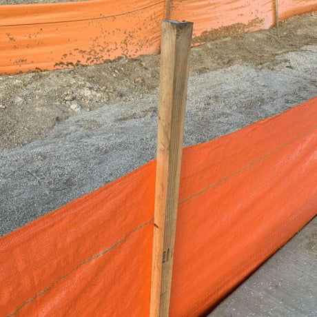 HEIGER bright orange silt fence with wooden stakes installed on construction site for erosion control