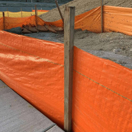 HEIGER orange silt fence installed on construction site to control sediment runoff and erosion